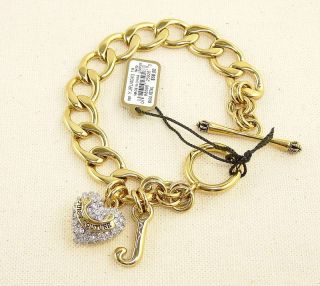 Authentic Juicy Couture gold plated started charm bracelet. Any