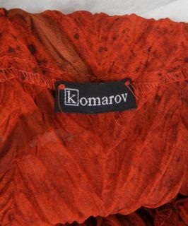 From KOMAROV comes this stunning crinkle pleated button down blouse
