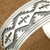 rug designs overlaid onto an oxidized cuff band. Hand stamped designs