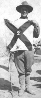 Private Wilferd Earl Leggett with the Camp Flag of the 2d California