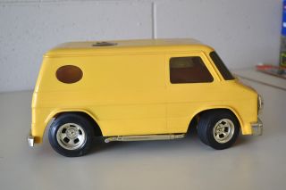 Vintage 1970s Yellow Chevy Van with Gold Rims Muffler Bumpers